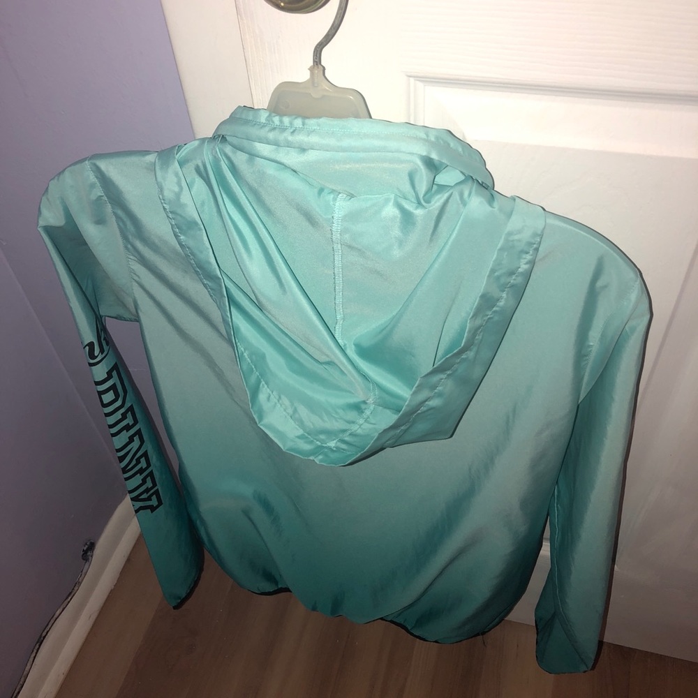 pink wind breaker.